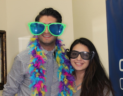 Doctor Ishani wearing giant sunglasses and lei with orthodontic patient
