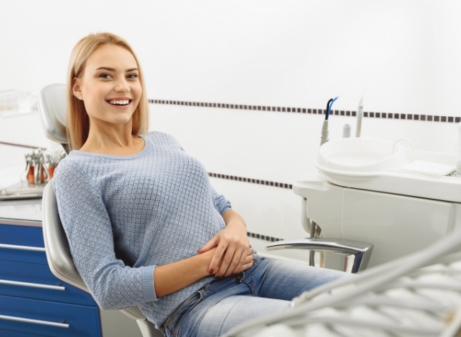 Smiling woman sitting in orthodontic treatment chair
