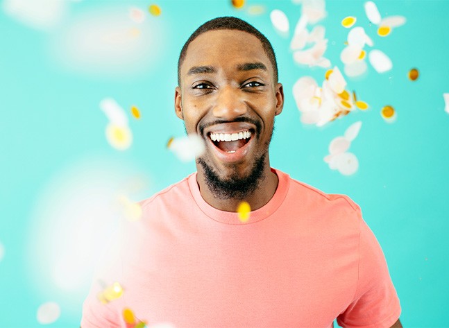 Man celebrating after getting gold braces in Oklahoma City