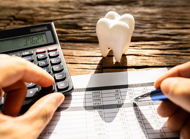 A patient calculating the cost of their orthodontic emergency