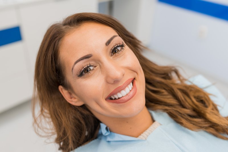 A beautiful woman smiling with straight teeth